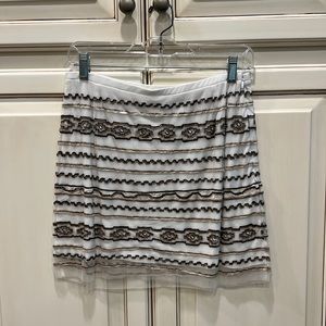 Chan Luu mini skirt. Available to shop 3/28/24